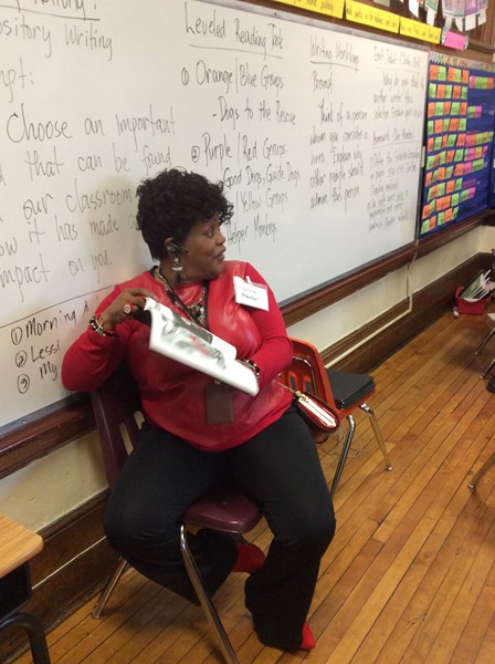 Ms. Donna Atwater  reads to third grade.